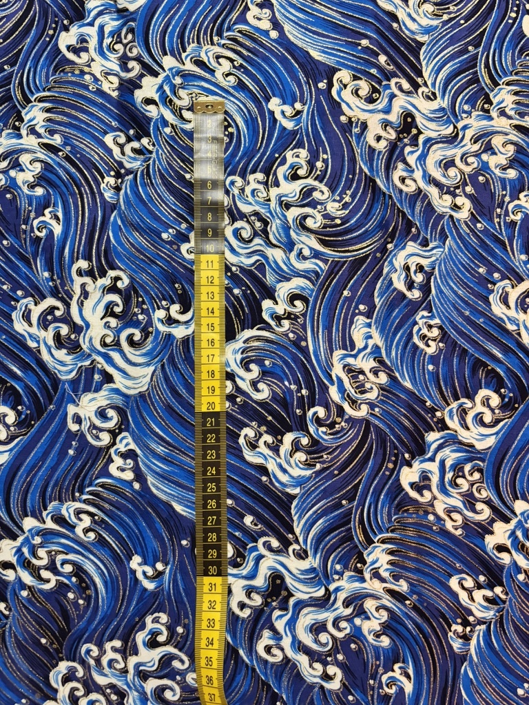 Tela olas azules y doradas